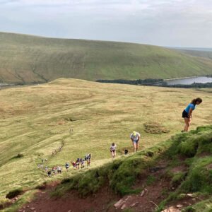 MDC members approaching the summit in Fan Fawr fell race